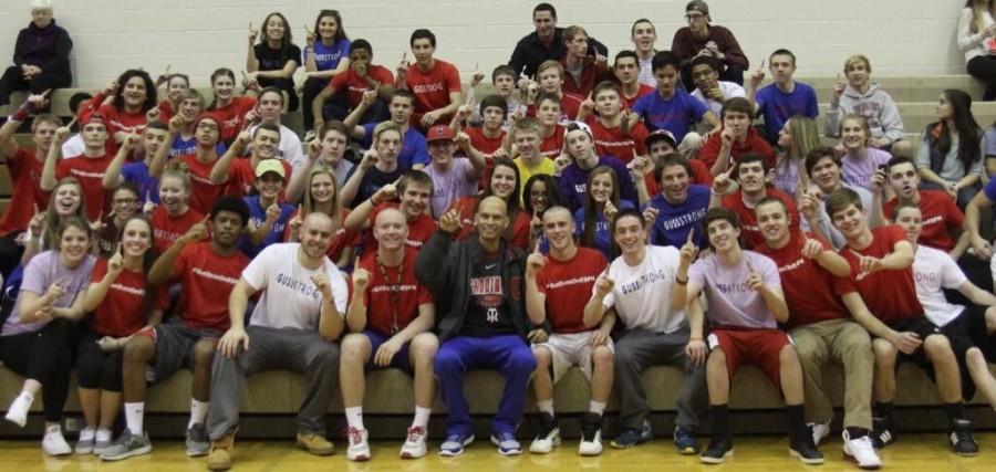 Students gather around Gussler during halftime of a 2013-14 Thomas Worthington basketball game.