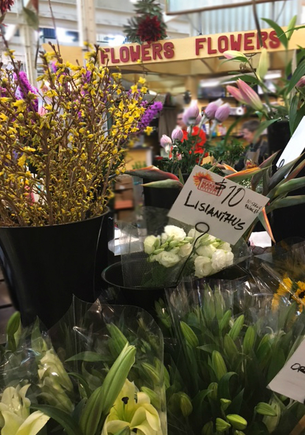 At the North Market vendors sell a variety of products, including flowers. 