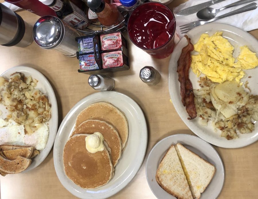 A breakfast of eggs, bacon, potatoes, toast, and pancakes from  Georges Linworth Diner