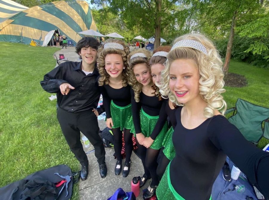 Dakota Curtiss and Maia Wolf (2nd and 3rd from left), a TWHS junior, and other Irish dancers in traditional Irish dance attire at a dance recital last season.
