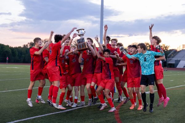 Mens Varsity soccer team celebrating post Wotown Showdown win. 