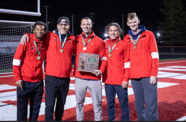 Head coach Matt Kovach (center)holding a district title with JvB Coach Kainnan Ramsey, Jv Coach Toni Stojcev and assistant coaches Max Rosenthal and Caleb Gruenbaum. after a 2-1 District finals win against Canal Winchester.