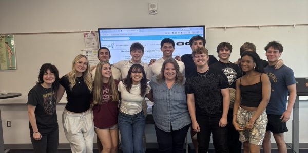 Ms. Ruiz, center, with students from her Advanced Journalism class